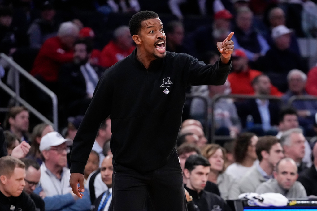 Providence head coach Kim English gestures during the first half of an NCAA college basketball game against the St. John's in the quarterfinals of the Big East tournament, Thursday, March 12, 2026, in New York. (AP Photo/Yuki Iwamura)