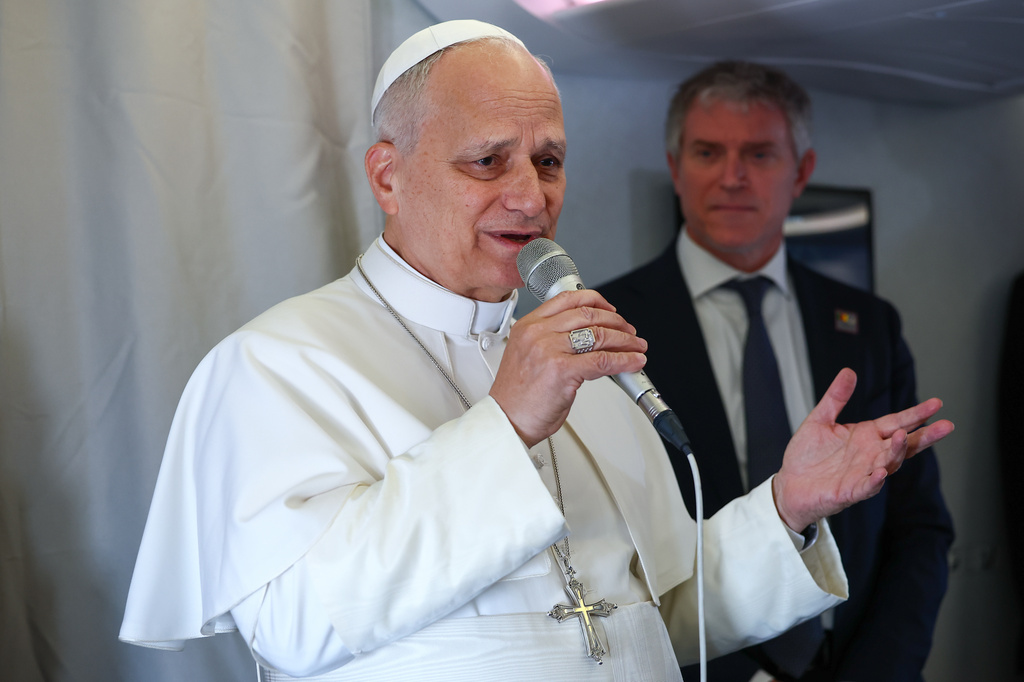 Pope Leo XIV speaks to journalists aboard his flight bound for Yaounde-Nsimalen International Airport, Cameroon, Wednesday, April 15, 2026, on the third day of an 11-day apostolic journey to Africa. (Guglielmo Mangiapane/Pool Photo via AP)