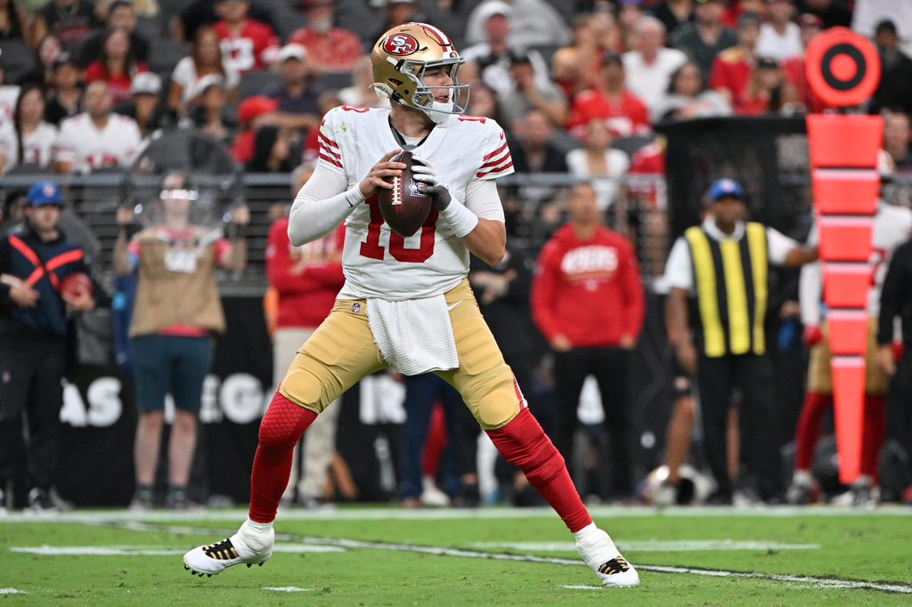 San Francisco 49ers quarterback Mac Jones looks for a receiver during the first half of an NFL preseason football game against the Las Vegas Raiders, Thursday, Aug. 27, 2026}, in Las Vegas. (AP Photo/David Becker)
