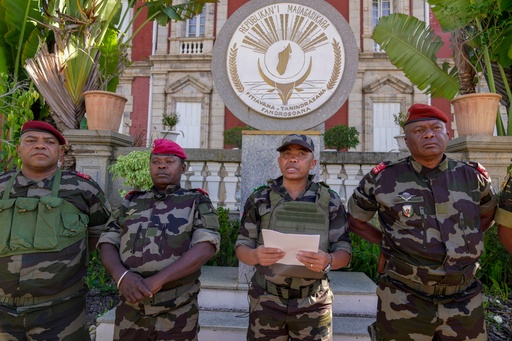 CAPSAT military unit commander Col. Michael Randrianirina, center, reads a statement saying that the armed forces are taking control of the country from the steps of the Presidency in Antananarivo, Madagascar, Tuesday, Oct. 14, 2025. (AP Photo/ Brian Inganga) CAPSAT military unit commander Col. Michael Randrianirina, center, reads a statement saying that the armed forces are taking control of the country from the steps of the Presidency in Antananarivo, Madagascar, Tuesday, Oct. 14, 2025. (AP Photo/ Brian Inganga)