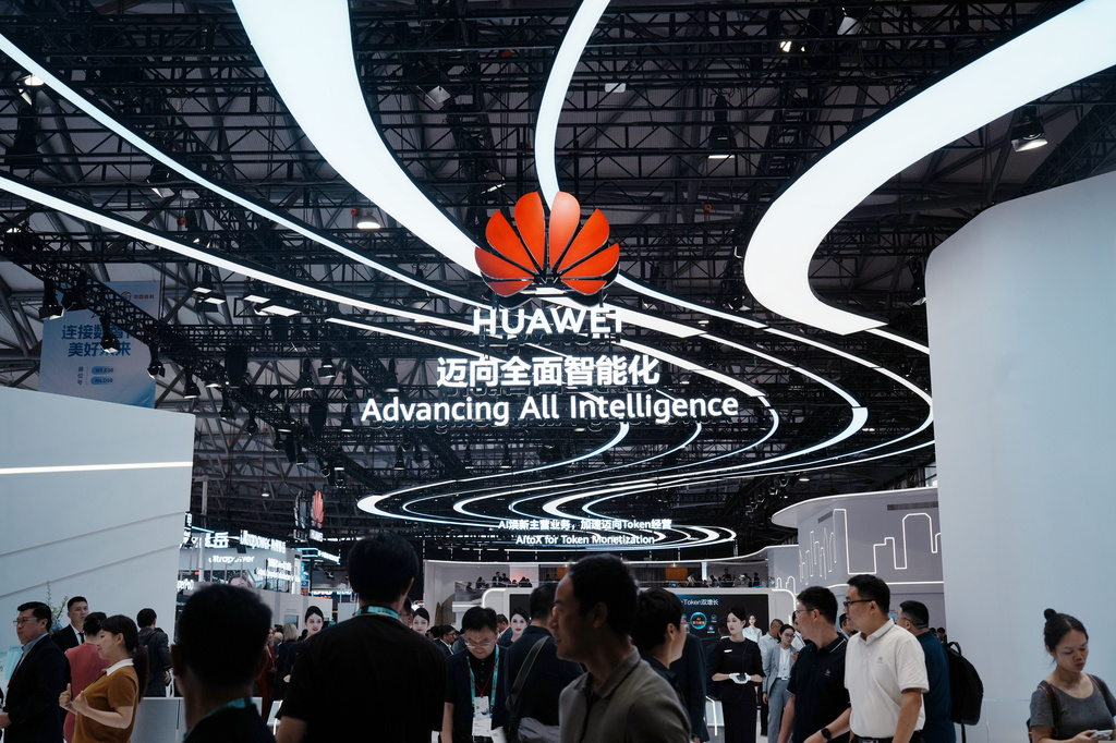 Visitors pass near the Huawei booth during the MWC26 in Shanghai, China on June 24, 2026. (Chinatopix via AP)