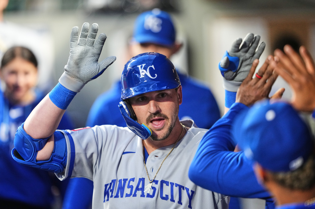 Kansas City Royals' Vinnie Pasquantino celebrates in the dugout after hitting a solo home run against the Seattle Mariners during the sixth inning of a baseball game, Friday, May 1, 2026, in Seattle. (AP Photo/Lindsey Wasson)