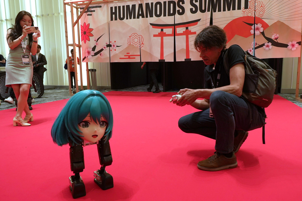 High Torque's Mini Pi bipedal robot is operated at the Humanoids Summit 2026 in Tokyo, Thursday, May 28, 2026. (AP Photo/Ayaka McGill)