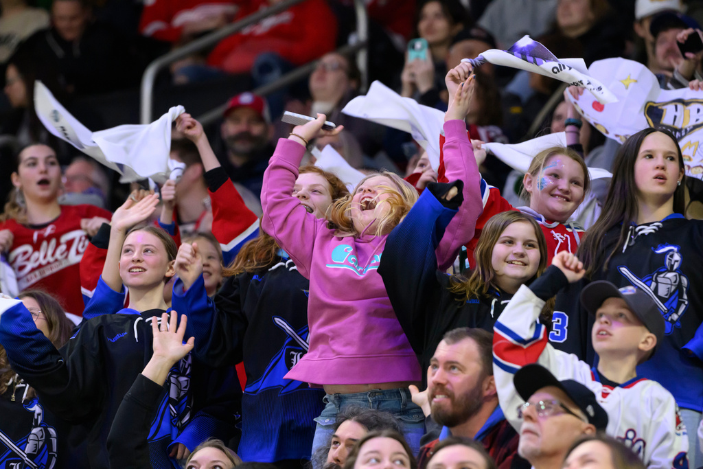 FILE -Fans get excited during the first period of a PWHL game between the New York Sirens and the Minnesota Frost, at Little Caesars Arena, in Detroit, Sunday, March 16, 2025. (David Guralnick/Detroit News via AP, File)