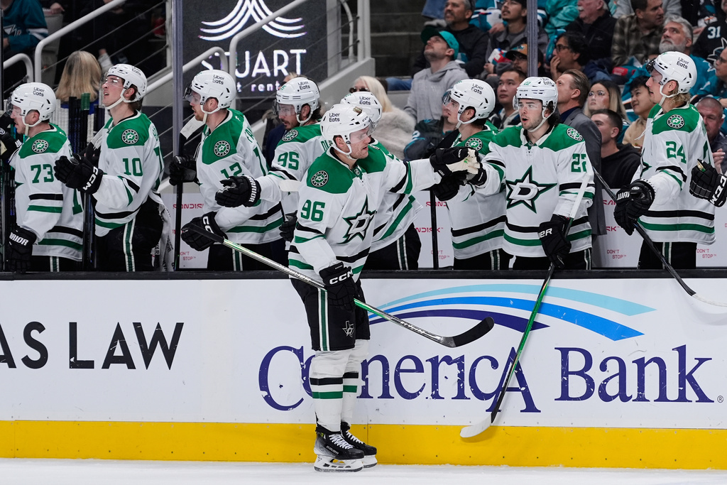Dallas Stars right wing Mikko Rantanen (96) celebrates with teammates after scoring a goal during the third period of an NHL hockey game against the San Jose Sharks, Saturday, Jan. 10, 2026, in San Jose, Calif. (AP Photo/Godofredo A. Vásquez)