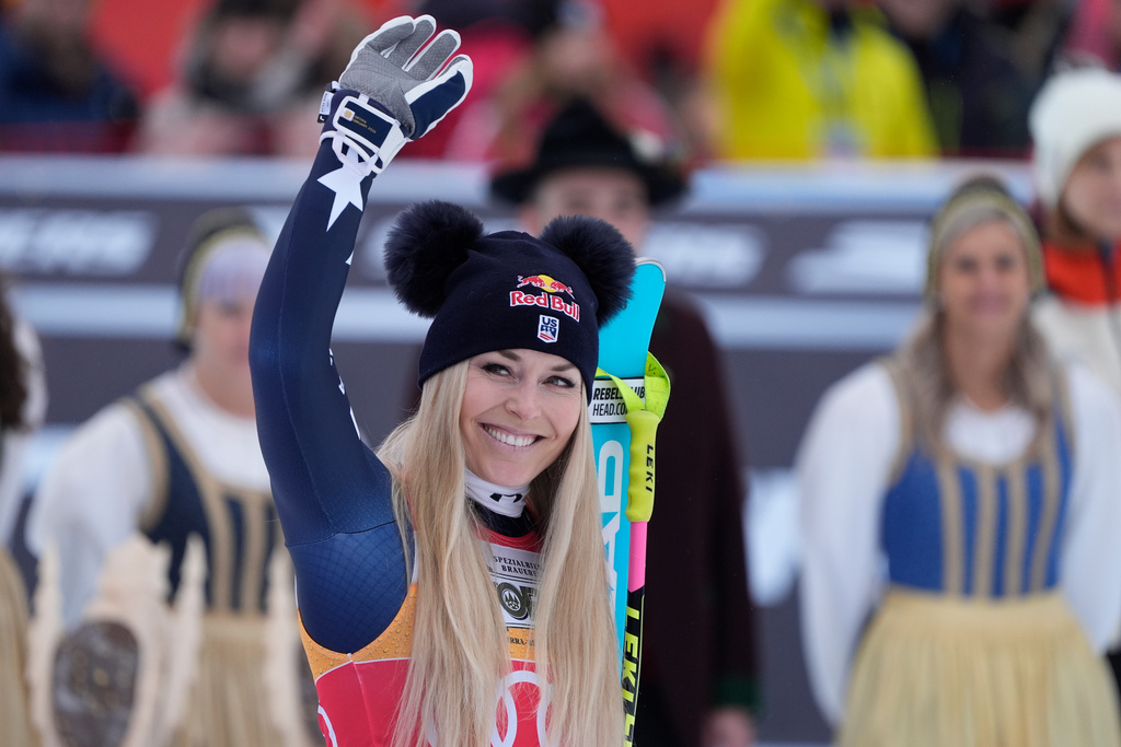 United States' Lindsey Vonn celebrates taking third place in an alpine ski, women's World Cup downhill, in Tarvisio, Italy, Saturday, Jan. 17, 2026. (AP Photo/Giovanni Auletta)