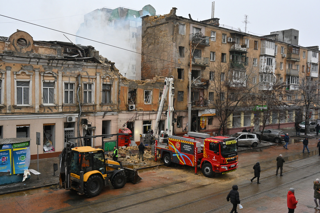 Rescue workers clear the rubble of a residential building which was heavily damaged after a Russian strike in Odesa, Ukraine, Tuesday, Jan. 27, 2026. (AP Photo/Michael Shtekel)