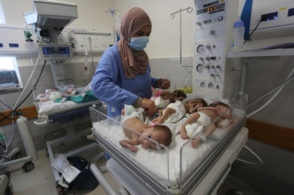 FILE - A nurse cares for prematurely born Palestinian babies that were brought from Shifa Hospital in Gaza City to the hospital in Rafah, Gaza Strip, Sunday, Nov. 19, 2023. (AP Photo/Hatem Ali, File)
