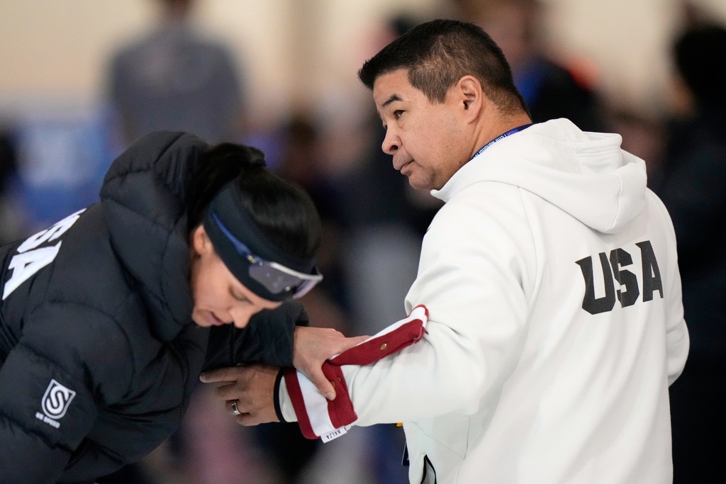 U.S. speedskating national coach Ryan Shimabukuro is seen at the U.S. Olympic trials for long track speed skating at the Pettit National Ice Center, Jan. 4, 2026, in Milwaukee. (AP Photo/Morry Gash)