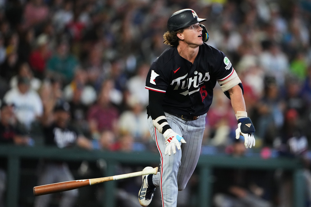 Minnesota Twins' Luke Keaschall follows through on a solo home run against the Seattle Mariners during the ninth inningof a baseball game, Sunday, Aug. 2, 2026, in Seattle. (AP Photo/Lindsey Wasson)