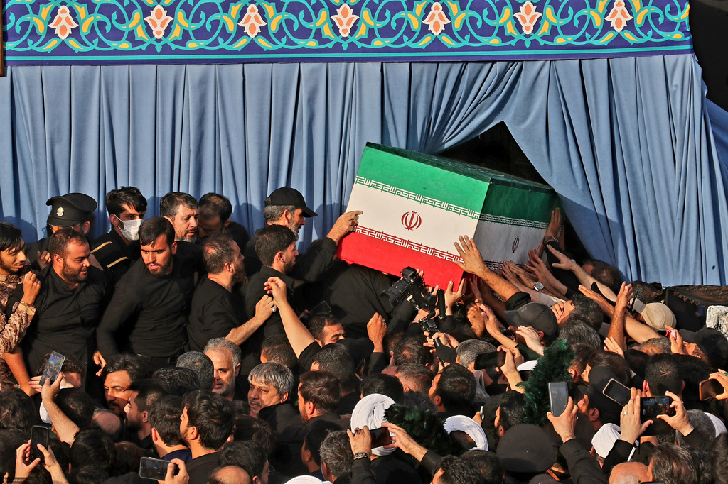 In this photo released by Iran's Supreme Leader's office, mourners carry the coffin of the late Iranian Supreme Leader Ayatollah Ali Khamenei during funeral prayers held as part of the dayslong funeral ceremonies at the Holy Jamkaran Mosque in Qom, Iran, Tuesday, July 7, 2026. (Office of the Iranian Supreme Leader via AP)