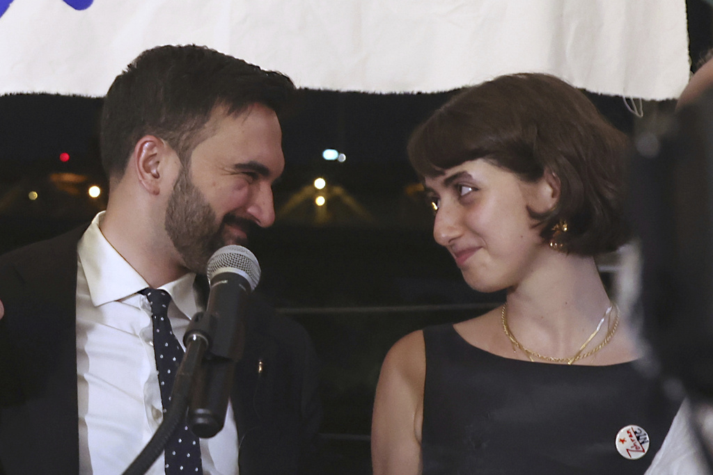 FILE - Democratic mayoral candidate Zohran Mamdani appears on stage with his wife, Rama Duwaji, right, at his primary election party, Wednesday, June 25, 2025, in New York. (AP Photo/Heather Khalifa, File)