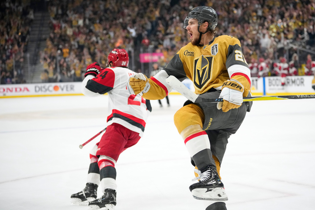 Vegas Golden Knights center Brett Howden, right, celebrates his goal as Carolina Hurricanes right wing Seth Jarvis skates away during the second period in Game 4 of the NHL hockey Stanley Cup Final series Tuesday, June 9, 2026, in Las Vegas. (AP Photo/John Locher)