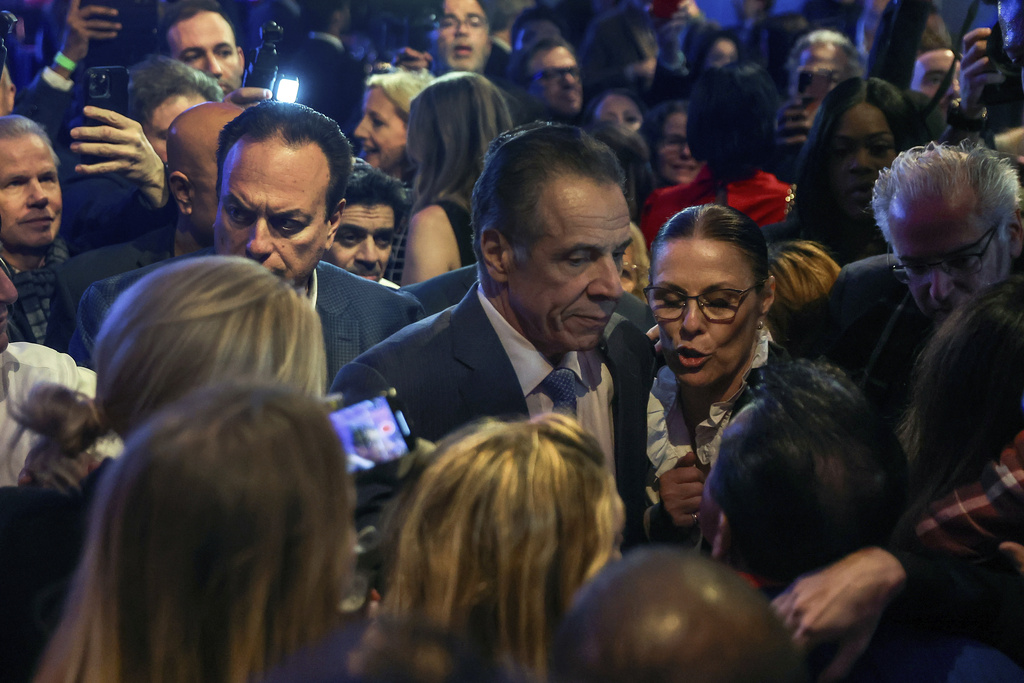 Andrew Cuomo talks with supporters after conceding the mayoral election to Zohran Mamdani, Tuesday, Nov. 4, 2025, in New York. (AP Photo/Heather Khalifa)