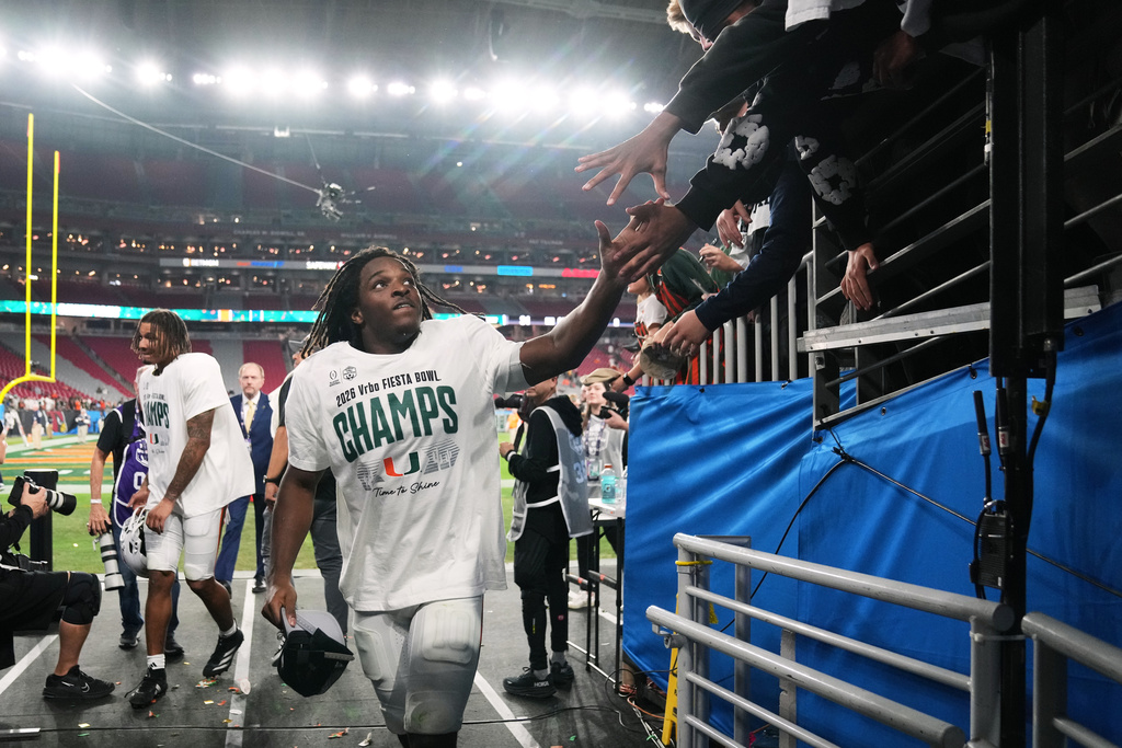 Miami wide receiver Malachi Toney leaves the field after the Fiesta Bowl NCAA college football playoff semifinal game against Mississippi, Thursday, Jan. 8, 2026, in Glendale, Ariz. (AP Photo/Rick Scuteri)