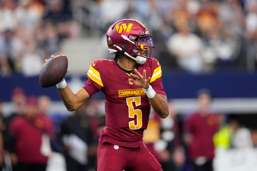 Washington Commanders quarterback Jayden Daniels (5) looks to pass against the Dallas Cowboys during the first half of an NFL football game Sunday, Oct. 19, 2025, in Arlington, Texas. (AP Photo/Jeffrey McWhorter) Washington Commanders quarterback Jayden Daniels (5) looks to pass against the Dallas Cowboys during the first half of an NFL football game Sunday, Oct. 19, 2025, in Arlington, Texas. (AP Photo/Jeffrey McWhorter)