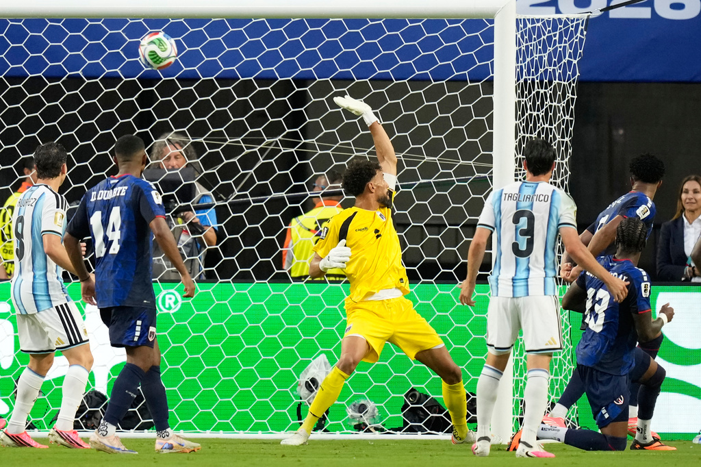 Cape Verde goalkeeper Vozinha fails to stop a shot by Argentina's Lisandro Martinez during the World Cup round of 32 soccer match in Miami Gardens, Fla., Friday, July 3, 2026. (AP Photo/Rebecca Blackwell)