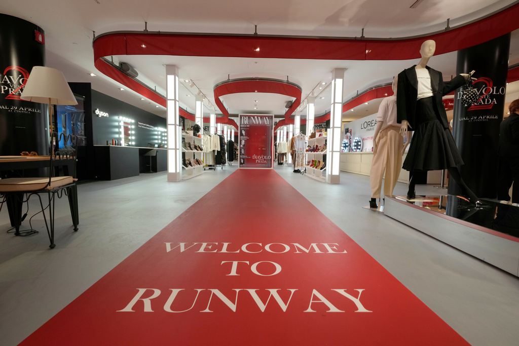 An installation of the new movie 'Devil Wears Prada 2' is displayed at La Rinascente shopping center, in Milan, Italy, Monday, April 20, 2026. (AP Photo/Luca Bruno)