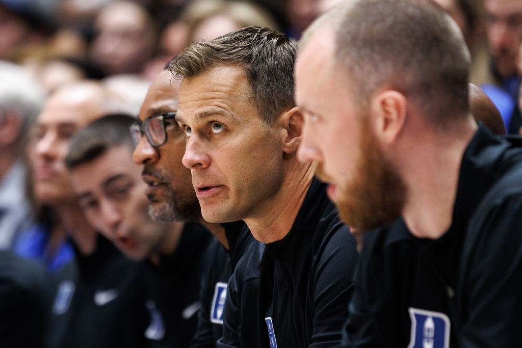 Duke head coach Jon Scheyer looks towards the court during the first half of an NCAA college basketball game against Western Carolina in Durham, N.C., Saturday, Nov. 8, 2025. (AP Photo/Ben McKeown)