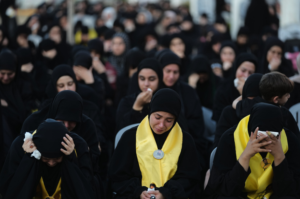 Women weep and mourn during a sermon marking the third day of Ashoura, the Shiite Muslim commemoration of the 7th-century death of Imam Hussein, the grandson of the Prophet Muhammad, in the southern port city of Tyre, Lebanon, Friday, June 19, 2026. (AP Photo/Hassan Ammar)