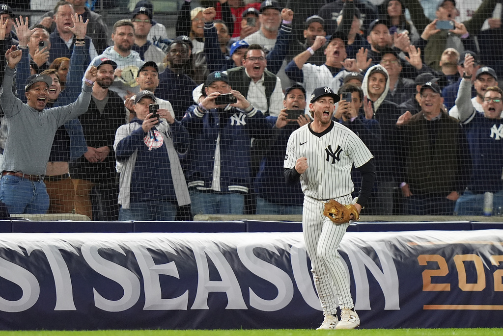 New York Yankees third baseman Ryan McMahon reacts after catching a fly ball in foul territory to end Game 3 of an American League wild-card baseball playoff series against the Boston Red Sox, Thursday, Oct. 2, 2025, in New York. (AP Photo/Frank Franklin II)