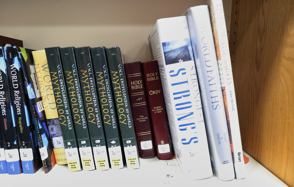 FILE - Copies of the Bible are displayed Aug. 12, 2024, at the Bixby High School library in Bixby, Okla. (AP Photo/Joey Johnson, File)
