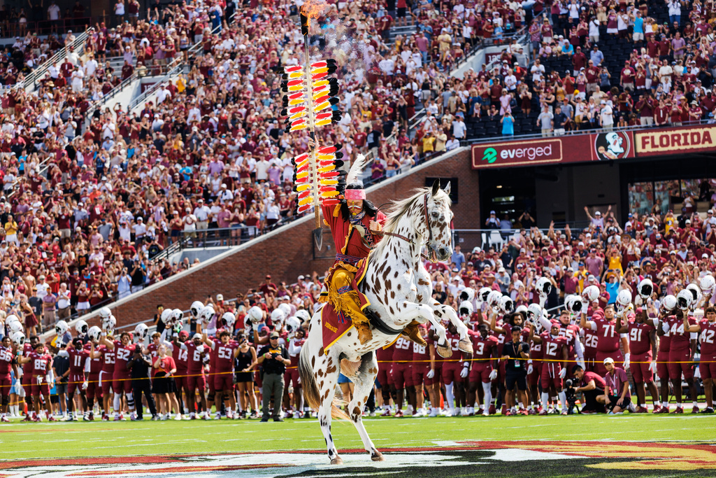 FILE - Florida State mascot Osceola, aboard Renegade, plants a flaming spear a midfield before an NCAA college football game against Kent State, Saturday, Sept. 20, 2025, in Tallahassee, Fla. (AP Photo/Colin Hackley, File)