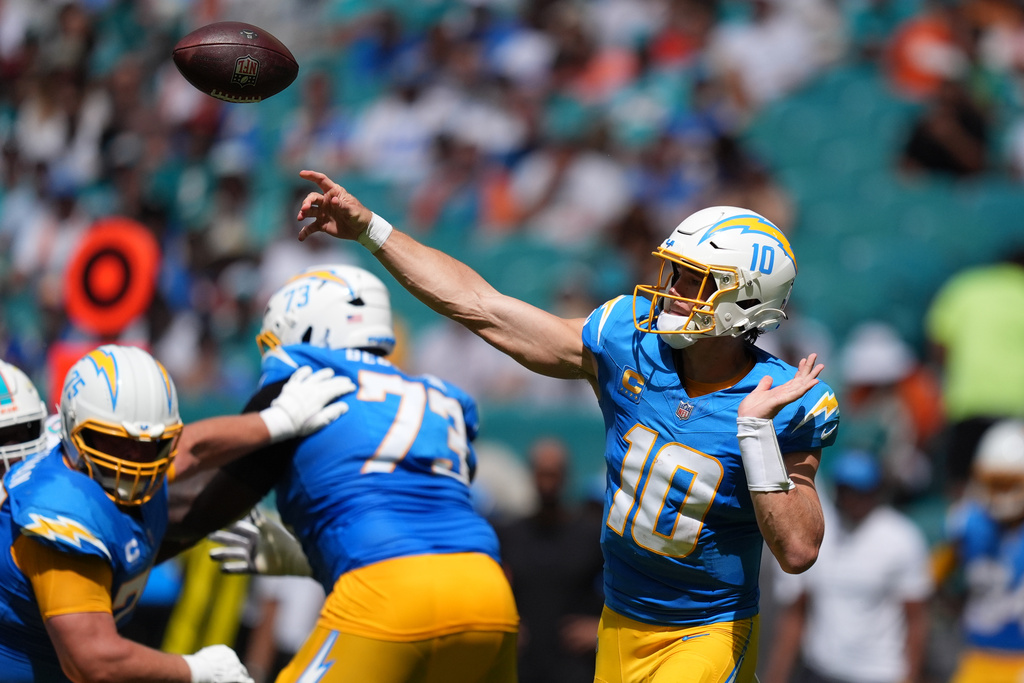 Los Angeles Chargers quarterback Justin Herbert throws a pass during the first half of an NFL football game against the Miami Dolphins Sunday, Oct. 12, 2025, in Miami Gardens, Fla. (AP Photo/Rebecca Blackwell)