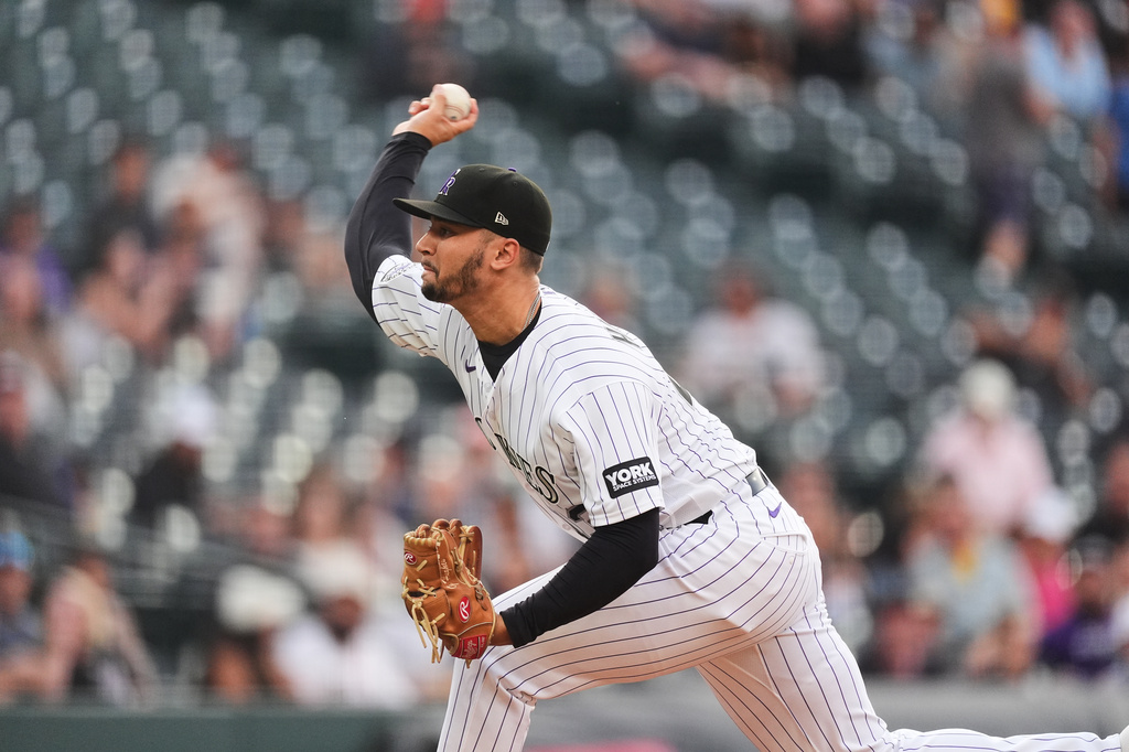 Colorado Rockies starting pitcher Gabriel Hughes works against the Tampa Bay Rays in the first inning of a baseball game Tuesday, Aug. 4, 2026, in Denver. (AP Photo/David Zalubowski)