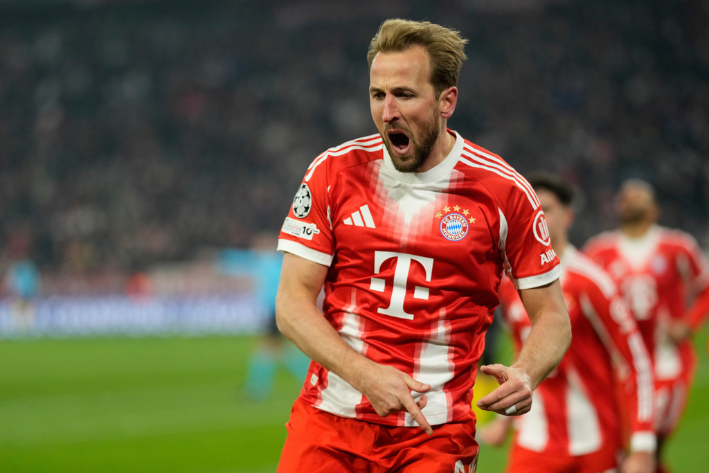Bayern's Harry Kane celebrates after scoring the opening goal during the Champions League opening phase soccer match between Bayern Munich and Union Saint-Gilloise, in Munich, Germany, Wednesday, Jan. 21, 2026. (AP Photo/Matthias Schrader)