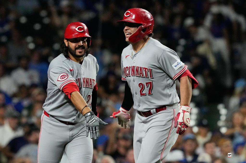 Cincinnati Reds' Sal Stewart, right, celebrates with Eugenio Suárez after hitting a solo home run during the seventh inning of a baseball game against the Chicago Cubs in Chicago, Sunday, Aug. 30, 2026. (AP Photo/Nam Y. Huh)