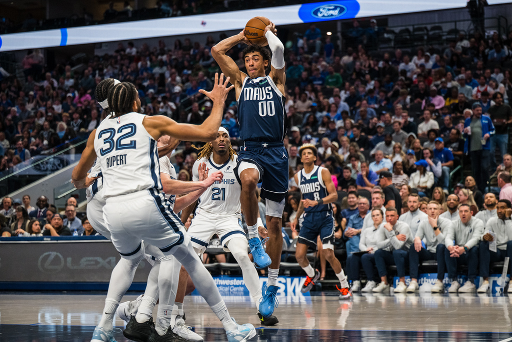 Dallas Mavericks guard Max Christie (00) looks to pass the ball during an NBA basketball game against the Memphis Grizzlies, Friday, Feb. 27, 2026, in Dallas. (AP Photo/Jessica Tobias)
