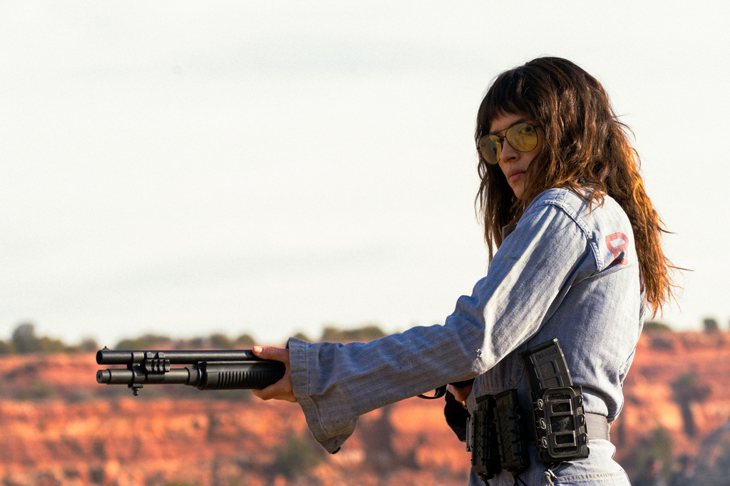 This image released by A24 shows Adria Arjona in a scene from "Onslaught." (Richard Foreman/A24 via AP)