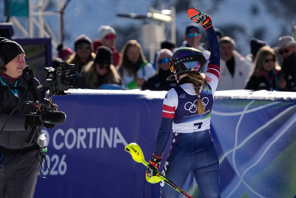 United States' Mikaela Shiffrin at the finish area of an alpine ski, women's slalom race, at the 2026 Winter Olympics, in Cortina d'Ampezzo, Italy, Wednesday, Feb. 18, 2026. (AP Photo/Andy Wong)