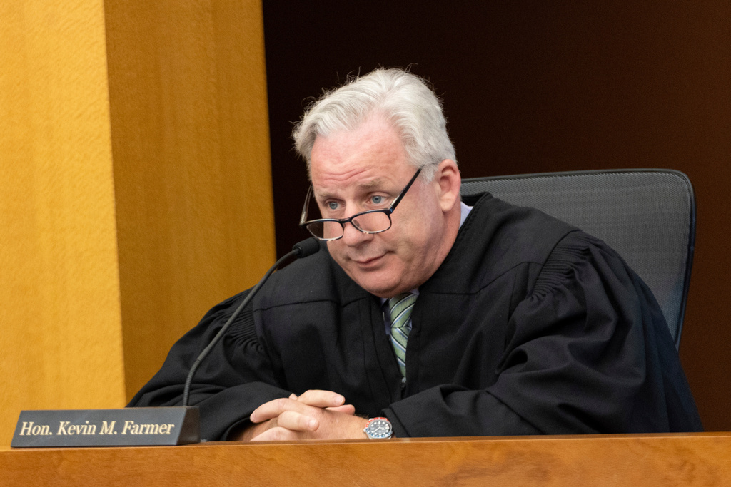 FILE - Judge Kevin Farmer listens during an Atlanta Public Safety Training Center RICO case at Fulton County Courthouse in Atlanta, July 7, 2025. (Arvin Temkar/Atlanta Journal-Constitution via AP, File)