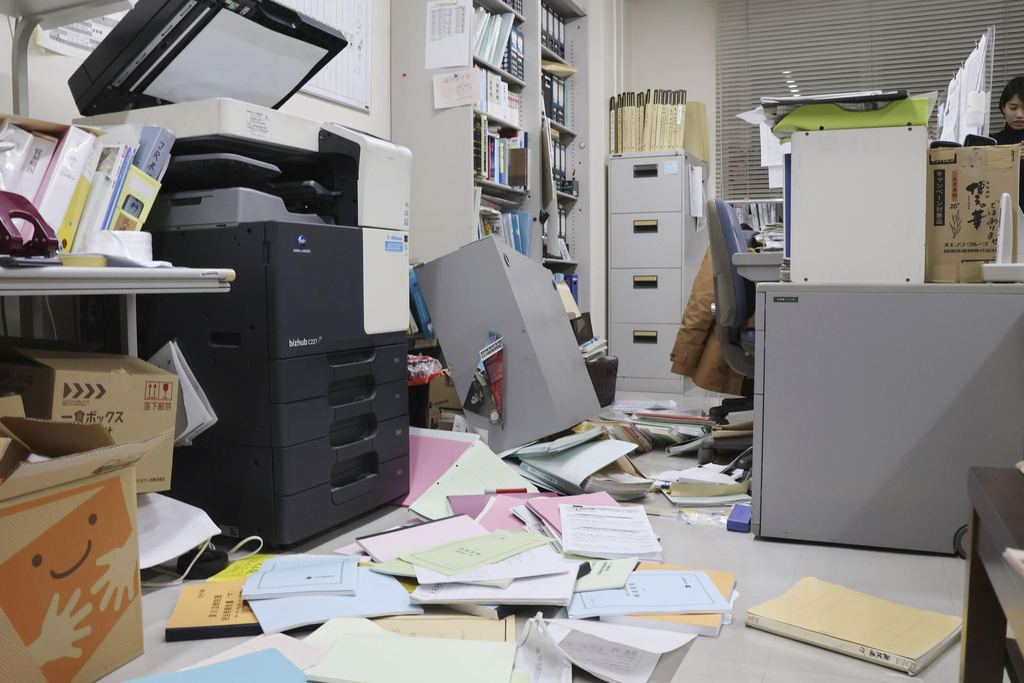 Papers are scattered on the floor at an office in Hakodate, Hokkaido, northern Japan Tuesday, Dec. 9, 2025, following a powerful earthquake on late Monday. (Kyodo News via AP)