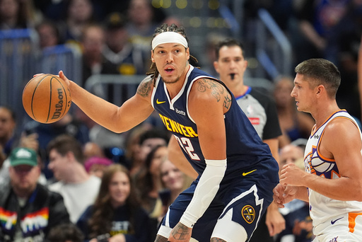 Denver Nuggets forward Aaron Gordon, left, looks to pass the ball as Phoenix Suns guard Grayson Allen, right, defends in the first half of an NBA basketball game Saturday, Oct. 25, 2025, in Denver. (AP Photo/David Zalubowski) Denver Nuggets forward Aaron Gordon, left, looks to pass the ball as Phoenix Suns guard Grayson Allen, right, defends in the first half of an NBA basketball game Saturday, Oct. 25, 2025, in Denver. (AP Photo/David Zalubowski)
