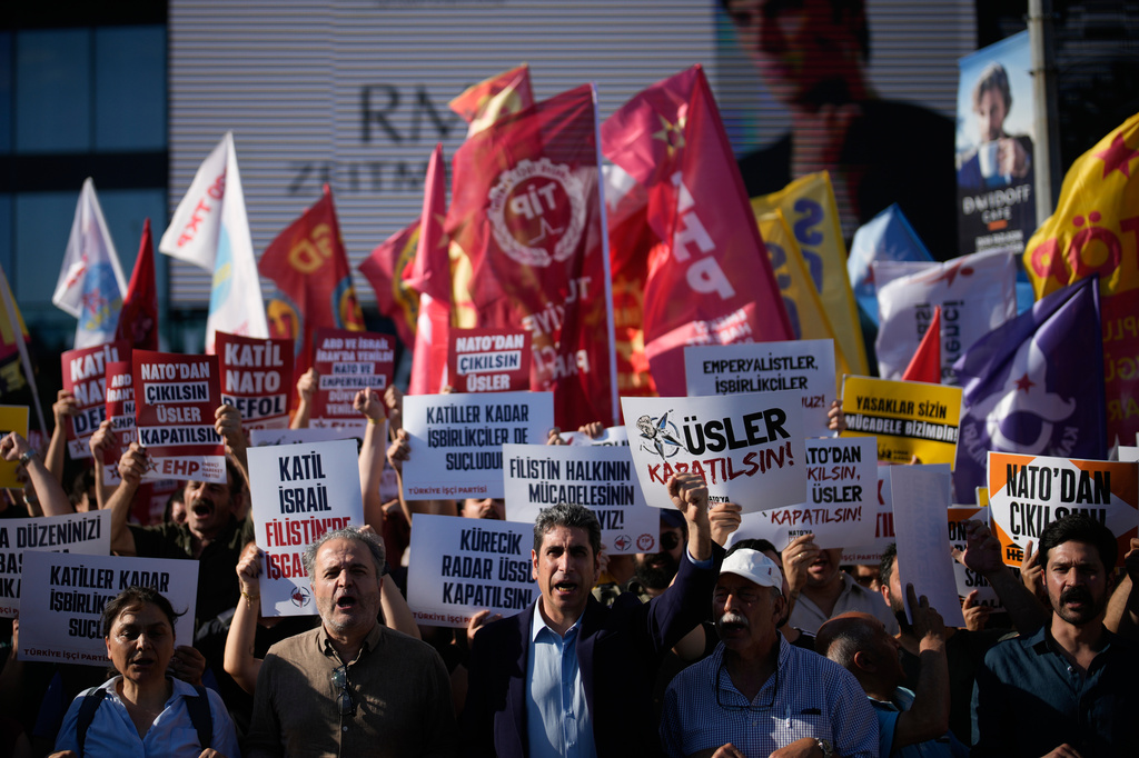 Demonstrators chant slogans and raise placards, during an anti-NATO protest in Istanbul, Turkey, Saturday, June 27, 2026, days ahead of the NATO summit scheduled to be held in Ankara on July 7-8.(AP Photo/Khalil Hamra)