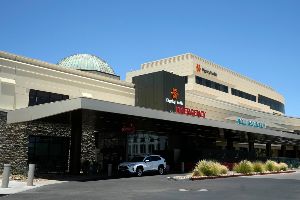 Mercy Gilbert Medical Center, shown here, where an 18-month-old toddler discovered in a backyard pool and taken to the hospital in February, was declared dead before being found breathing hours later in a room that serves as the hospital morgue, according to recently released police records, Monday, July 6, 2026, in Gilbert, Ariz. (AP Photo/Ross D. Franklin)