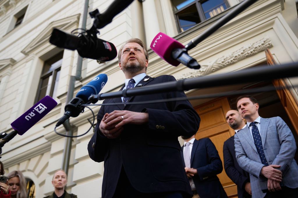 Yabloko party leader Nikolai Rybakov speaks to his supporters and journalists after hearing an appeal on a lawsuit to bar the party from the upcoming parliamentary elections, at the Russia's Supreme Court, in Moscow, Monday, Aug. 17, 2026. (AP Photo/Pavel Bednyakov)