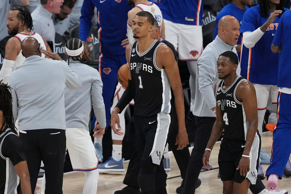 The San Antonio Spurs leave the court after Game 1 of the NBA Finals basketball series against the New York Knicks, Wednesday, June 3, 2026, in San Antonio. (AP Photo/Eric Gay)