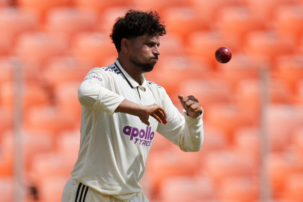 India's Kuldeep Yadav prepares to bowls a delivery on the third day of the first Test cricket match between India and West Indies at Narendra Modi Stadium in Ahmedabad, India, Saturday, Oct. 4, 2025. (AP Photo/Ajit Solanki)