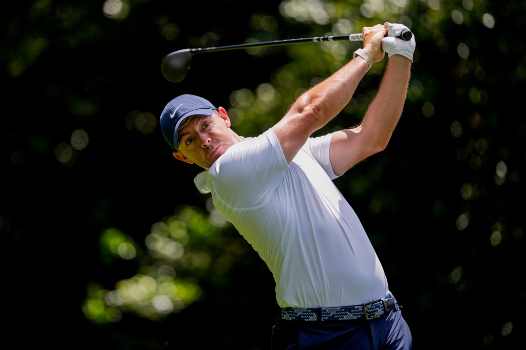 Rory McIlroy, of Northern Ireland, hits from the 14th tee during first round of the Truist Championship golf tournament at the Quail Hollow Club, Thursday, May 7, 2026, in Charlotte, N.C. (AP Photo/Chris Carlson)