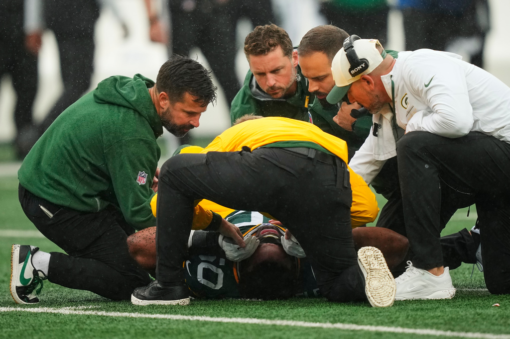 Green Bay Packers guard Zach Bako-Bewele (50) is tended to on the field during an NFL football game against the New York Jets in East Rutherford, N.J., Sunday, Sept. 20, 2026. (AP Photo/Yuki Iwamura)
