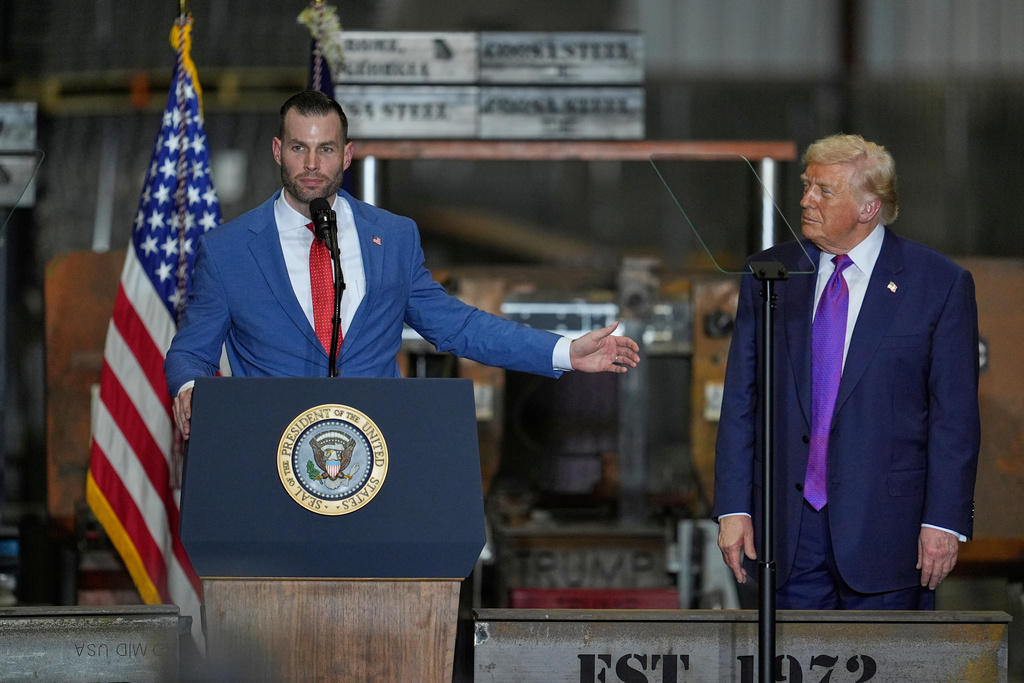 Congressional candidate Clay Fuller speaks as President Donald Trump listens at a rally at Coosa Steel Corporation in Rome, Ga., Thursday, Feb. 19, 2026. (AP Photo/George Walker IV)