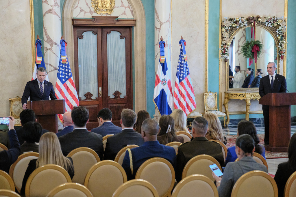 U.S. Secretary of Defense Pete Hegseth, left, and Dominican Republic President Luis Abinader speak during a press conference at the National Palace in Santo Domingo, Dominican Republic, Wednesday, Nov. 26, 2025. (AP Photo/Ricardo Hernadez)
