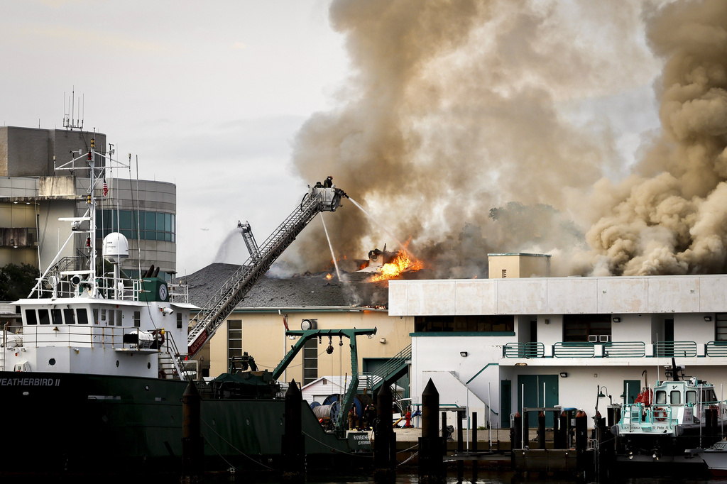 Firefighters work to extinguish a fire at the University of South Florida campus Saturday, May 2, 2026, in St. Petersburg, Fla. (Luis Santana/Tampa Bay Times via AP)