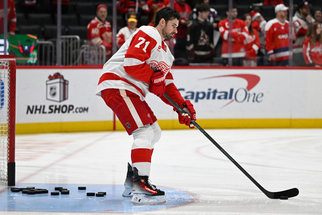 Detroit Red Wings center Dylan Larkin warms up before an NHL hockey game against the Washington Capitals Saturday, Dec. 20, 2025, in Washington. (AP Photo/John McDonnell)