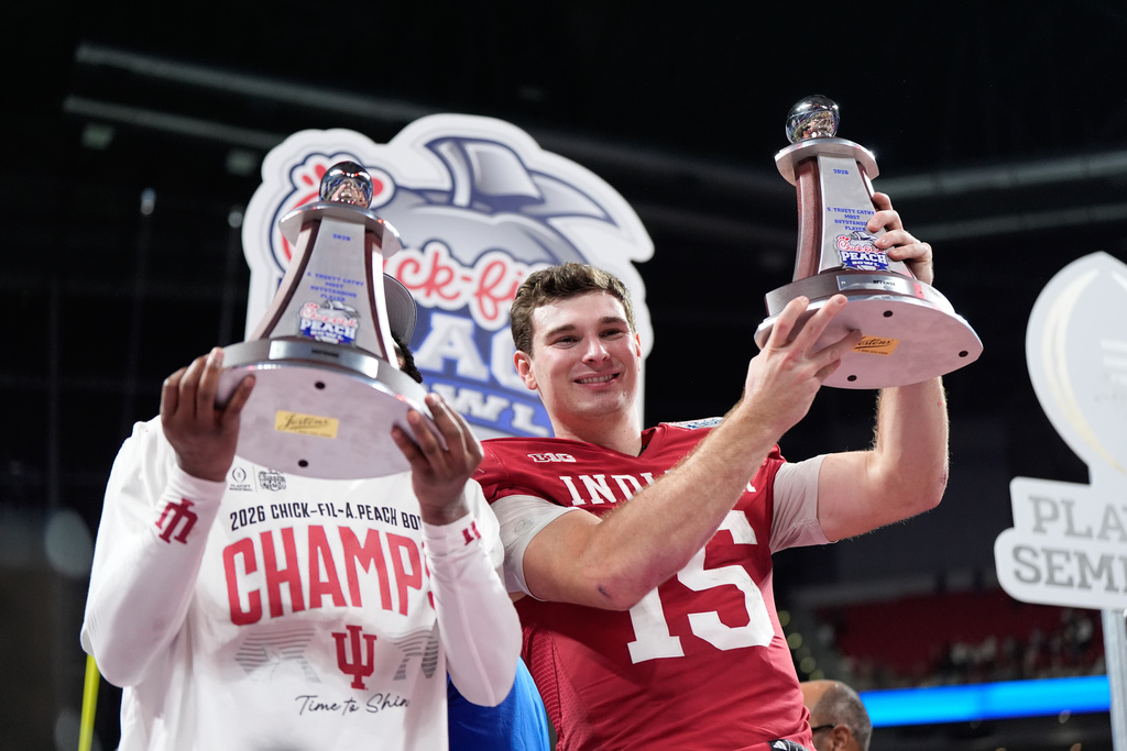 Indiana quarterback Fernando Mendoza (15) celebrates after the Peach Bowl NCAA college football playoff semifinal against Oregon, Friday, Jan. 9, 2026, in Atlanta. (AP Photo/Brynn Anderson)