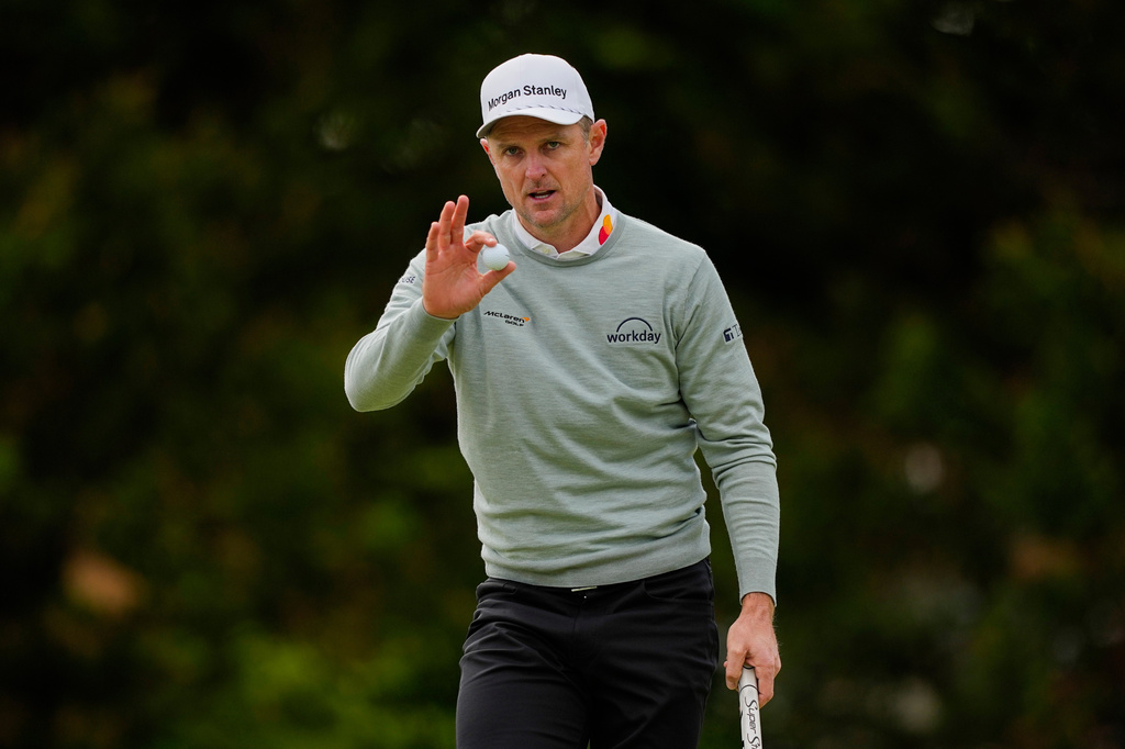Justin Rose, of England, waves after his putt on the 12th green during the second round of the PGA Championship golf tournament at Aronimink Golf Club, Friday, May 15, 2026, in Newtown Square, PA. (AP Photo/Carolyn Kaster)